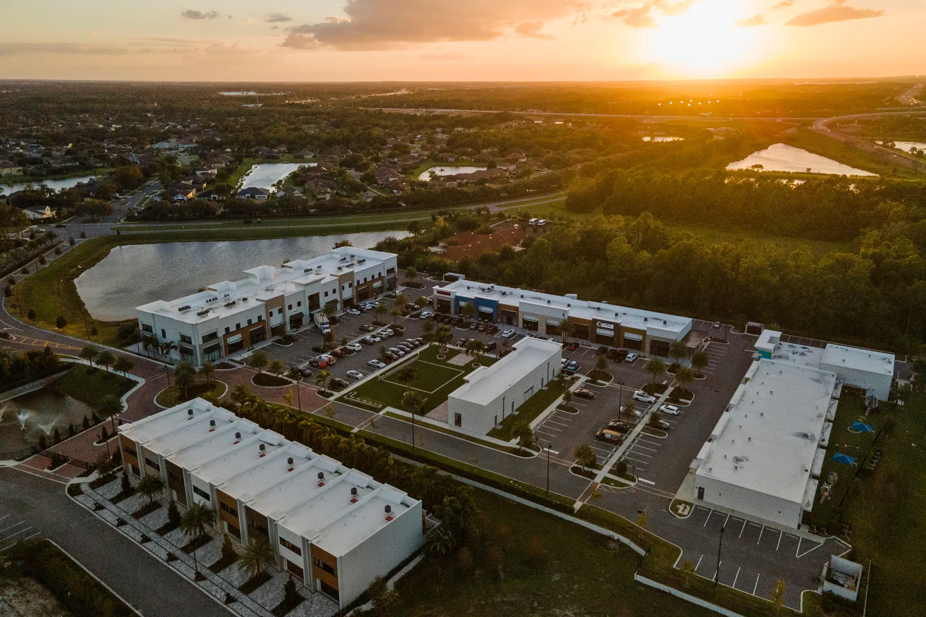 Aerial view over Inspiration Town Center at sunset
