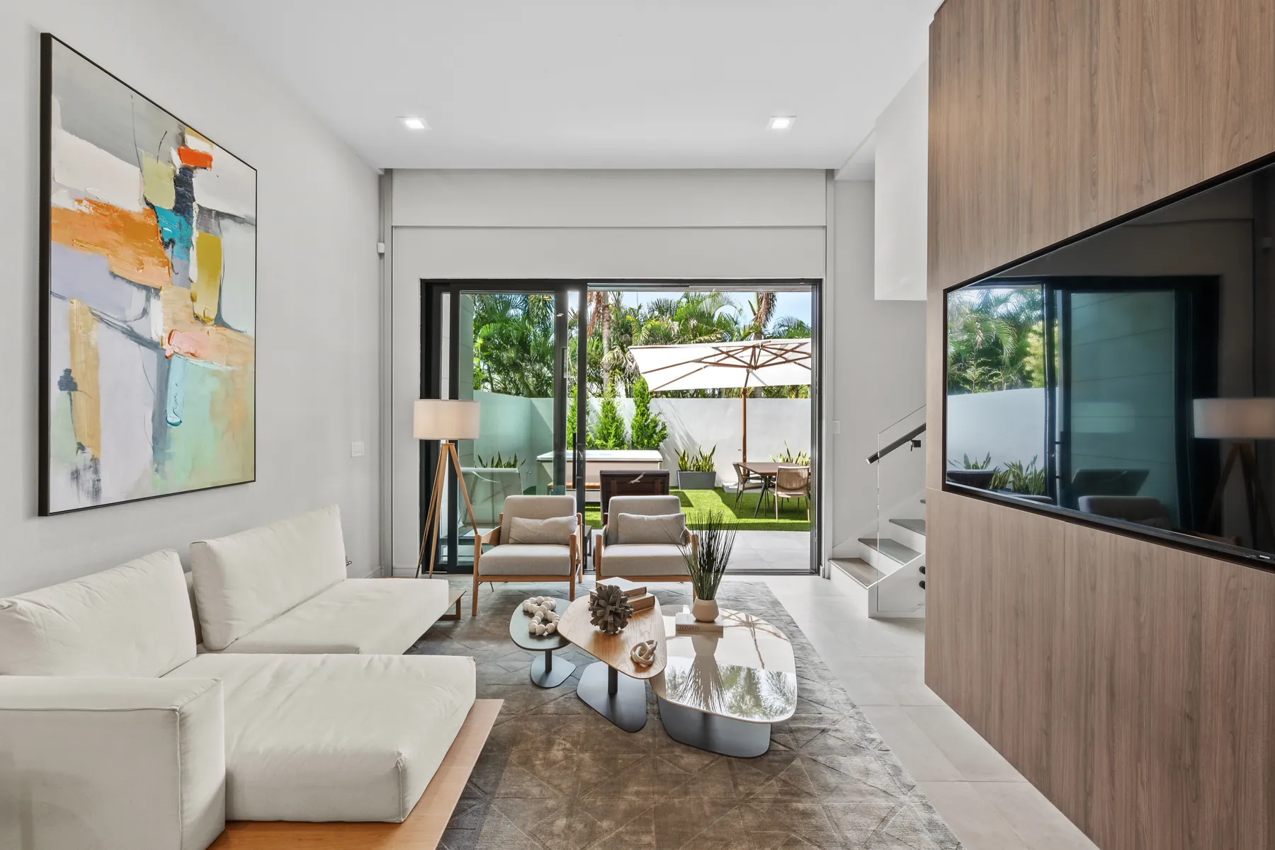 Living room of 966 Excellence Circle opening to the backyard